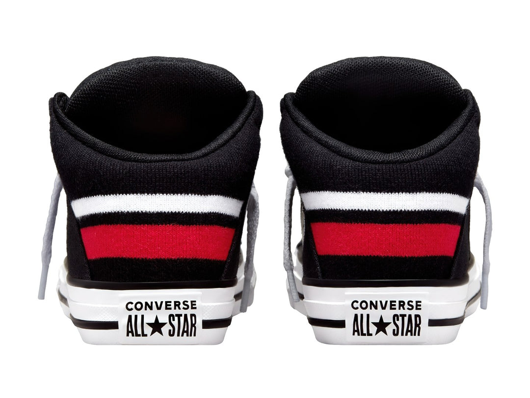 Tenis Converse Chuck Taylor All Star Axel Mid color negro con suela blanca y franja roja en el talón.