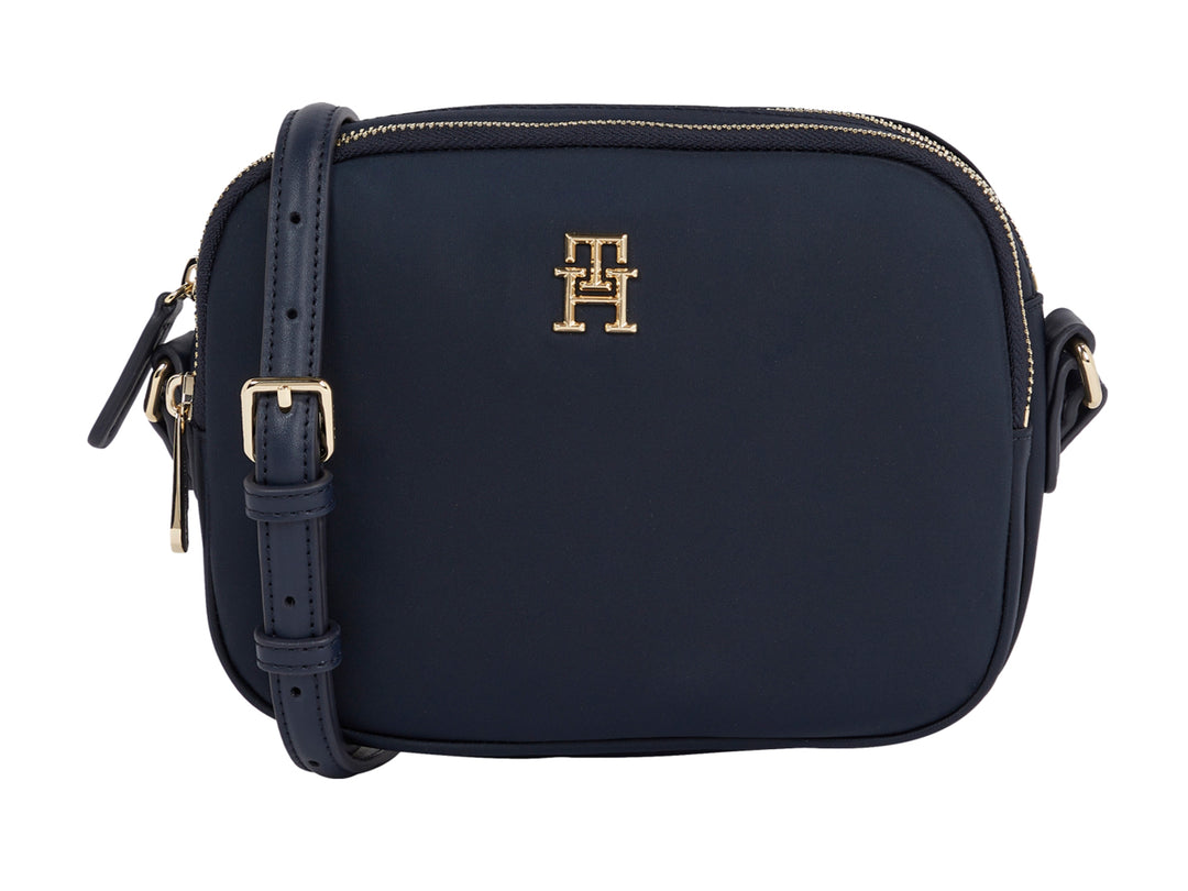 Bolsa pequeña Tommy Hilfiger color azul marino con herrajes y logotipo dorado.