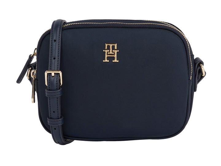 Bolsa pequeña Tommy Hilfiger color azul marino con herrajes y logotipo dorado.