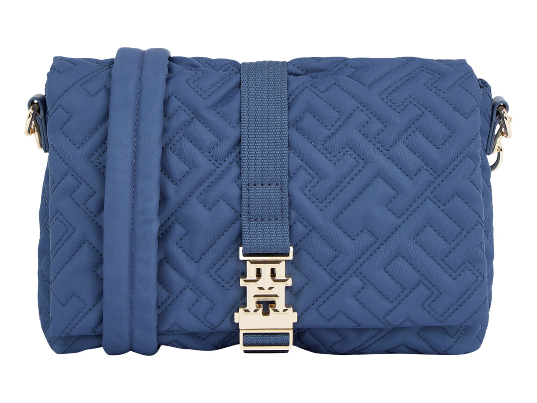 Bolso azul acolchado de Tommy Hilfiger con correa y herrajes dorados.
