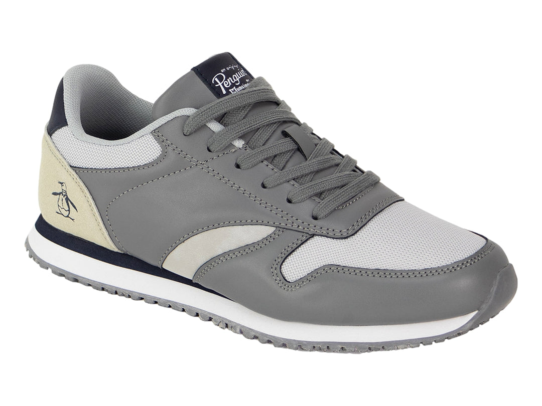 Tenis PENGUIN SEAN color gris con detalles en marino y beige, suela blanca y cordones grises.