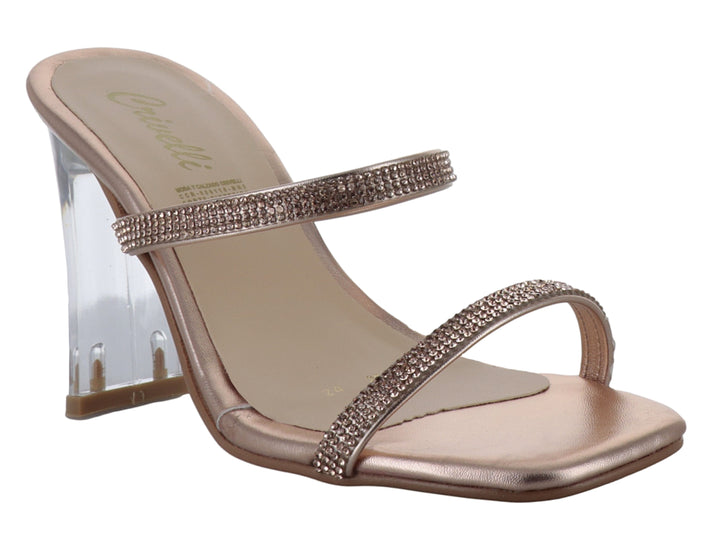 Sandalia color oro rosa con tacón cuadrado transparente y tiras decoradas con brillantes.