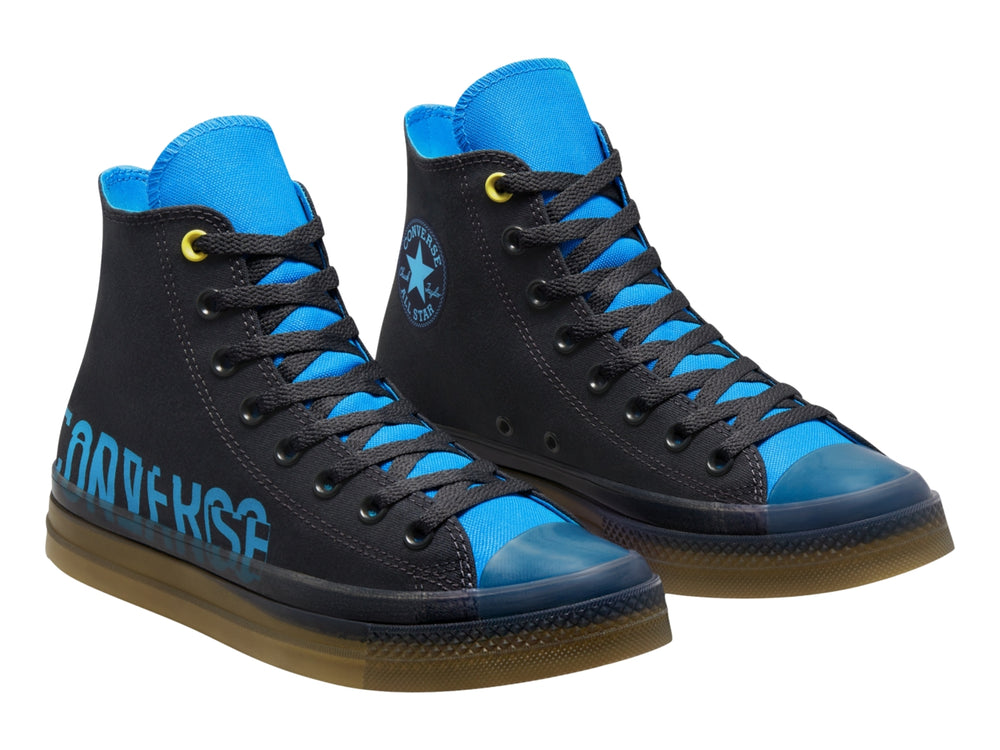 Tenis Converse Chuck Taylor All Star CX Hi en color gris oscuro con detalles en azul y suela translúcida amarilla.