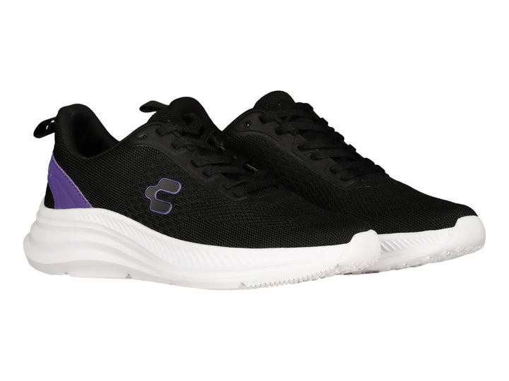 Tenis deportivos Charly color negro con suela blanca y detalles en morado.