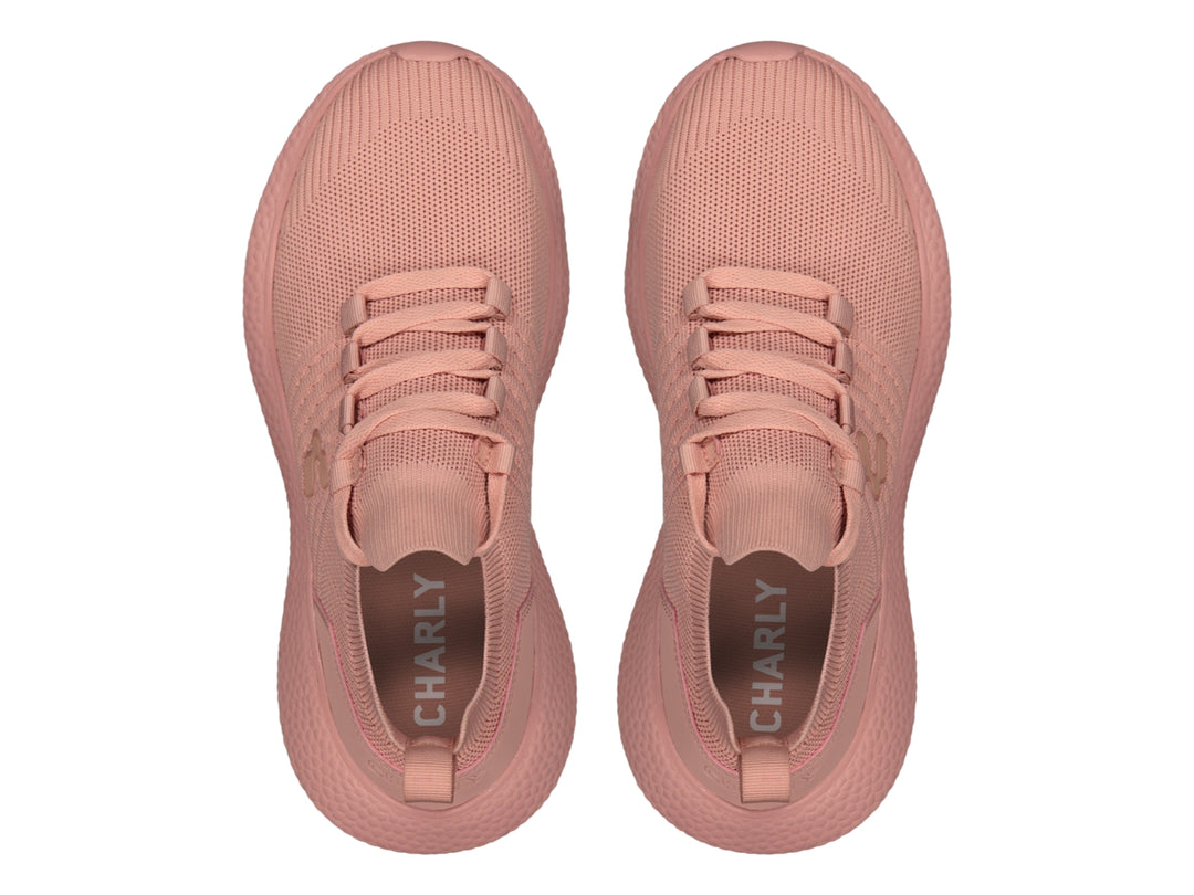 Tenis deportivos Charly de color rosa con tejido transpirable y suela texturizada.