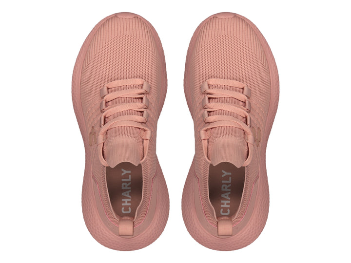 Tenis deportivos Charly de color rosa con tejido transpirable y suela texturizada.