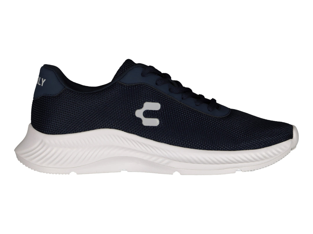 Tenis deportivos Charly en color azul marino con suela blanca y logotipo blanco lateral.