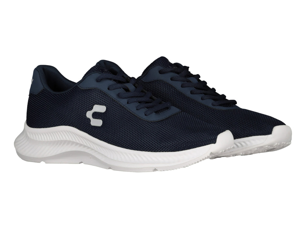 Tenis deportivos Charly en color azul marino con suela blanca y logotipo blanco lateral.