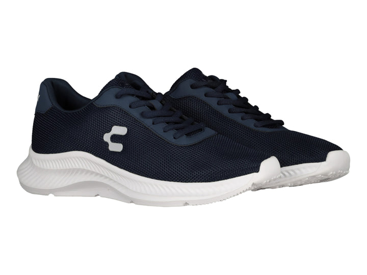 Tenis deportivos Charly en color azul marino con suela blanca y logotipo blanco lateral.