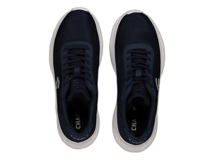 Tenis deportivos Charly en color azul marino con suela blanca y logotipo blanco lateral.