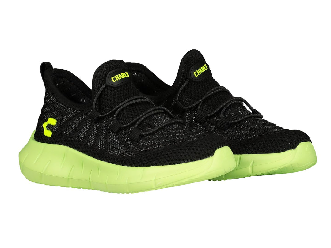 Tenis deportivos Charly color negro con suela gruesa verde lima.
