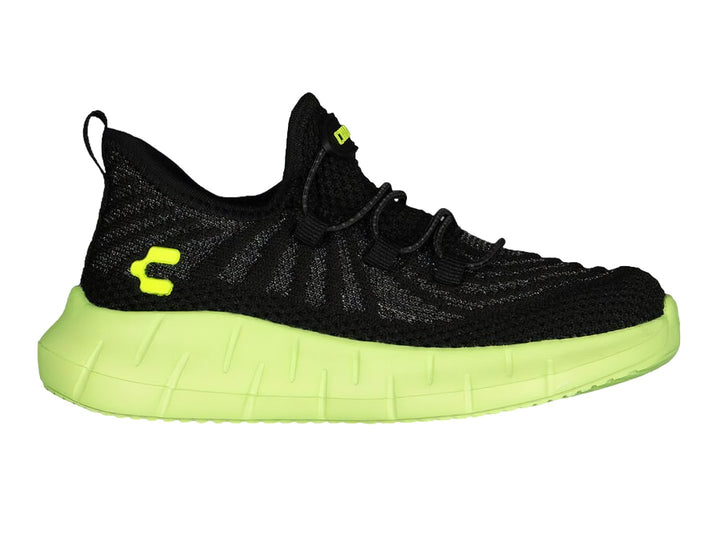 Tenis deportivos Charly color negro con suela gruesa verde lima.