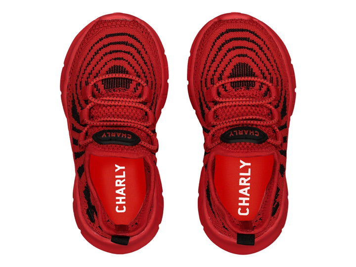 Tenis deportivos Charly color rojo con detalles en negro y suela gruesa.