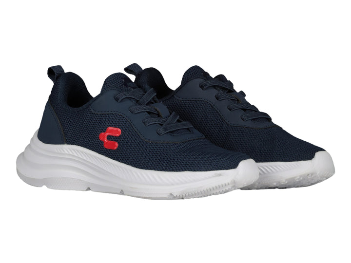 Tenis deportivos Charly en color azul marino con suela blanca y detalle rojo lateral.