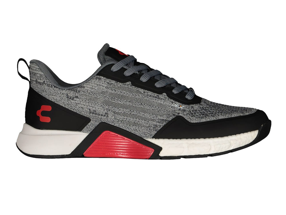 Tenis deportivos Charly color gris y negro con detalles en rojo y suela blanca.