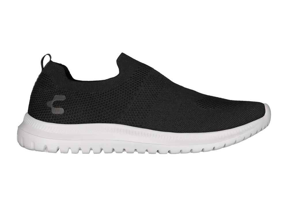 Par de tenis deportivos Charly estilo slip-on en color negro con suela blanca contrastante.