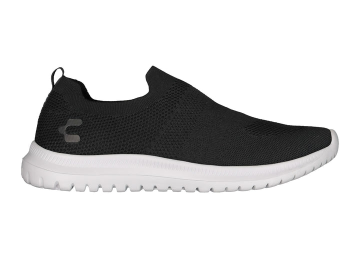 Par de tenis deportivos Charly estilo slip-on en color negro con suela blanca contrastante.