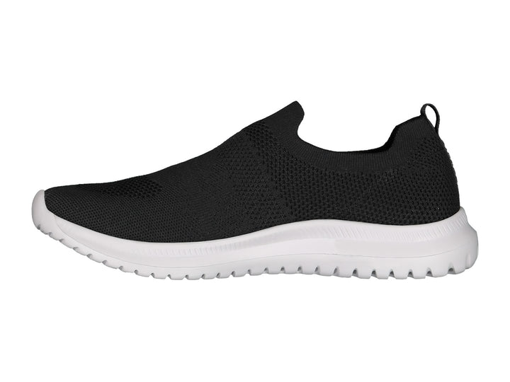 Par de tenis deportivos Charly estilo slip-on en color negro con suela blanca contrastante.