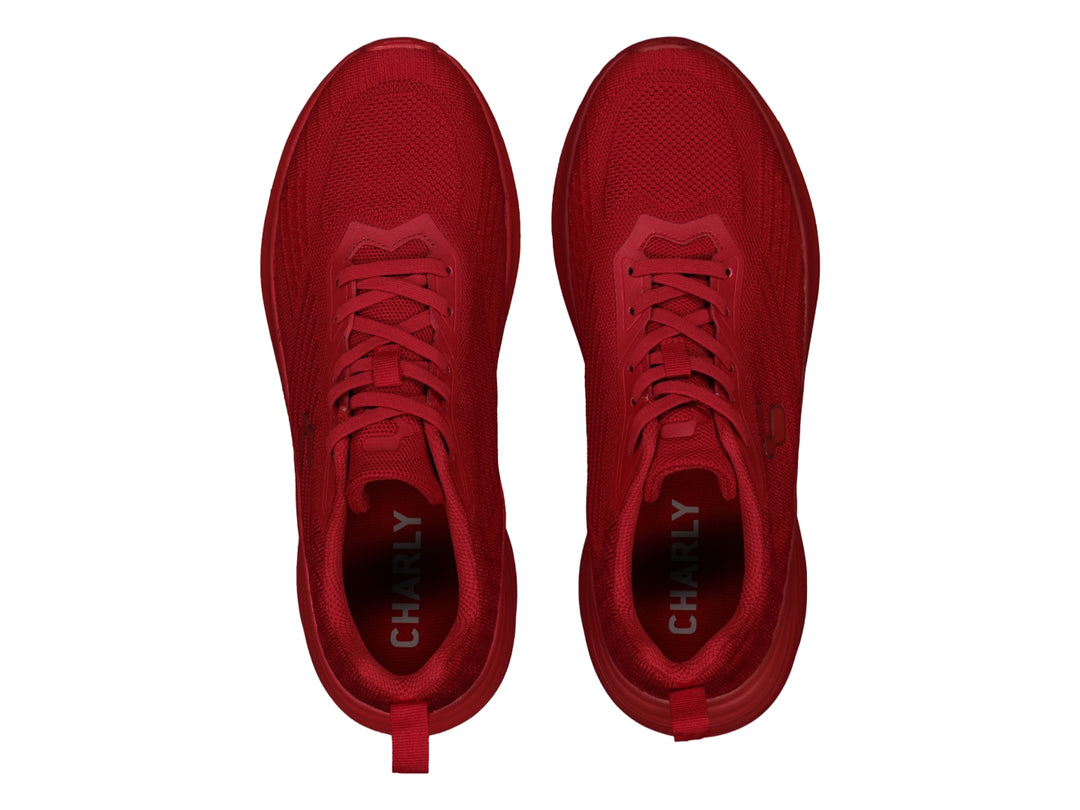 Tenis deportivos Charly en color rojo sólido con acabado tejido y suela a juego.