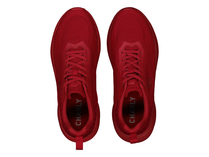 Tenis deportivos Charly en color rojo sólido con acabado tejido y suela a juego.