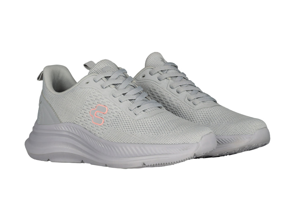 Tenis deportivos Charly color gris con tejido de malla y suela gruesa.