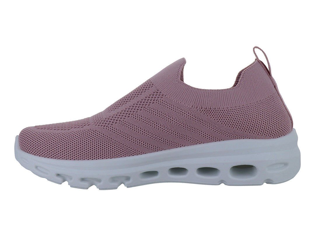 Tenis deportivos color rosa con suela blanca, diseño sin agujetas y tejido transpirable.