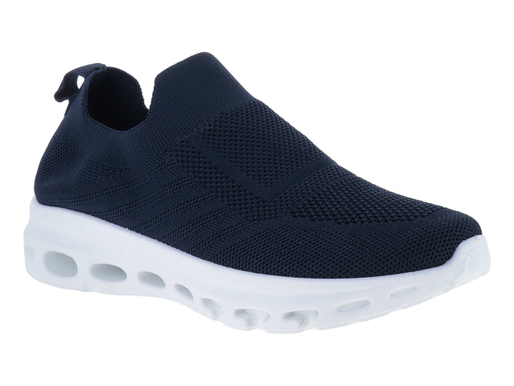 Zapato deportivo slip-on de color azul marino con suela blanca gruesa y perforada.