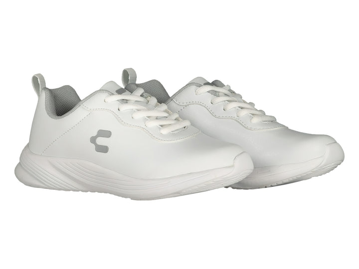 Par de tenis deportivos marca Charly en color blanco con detalles en gris y agujetas blancas.