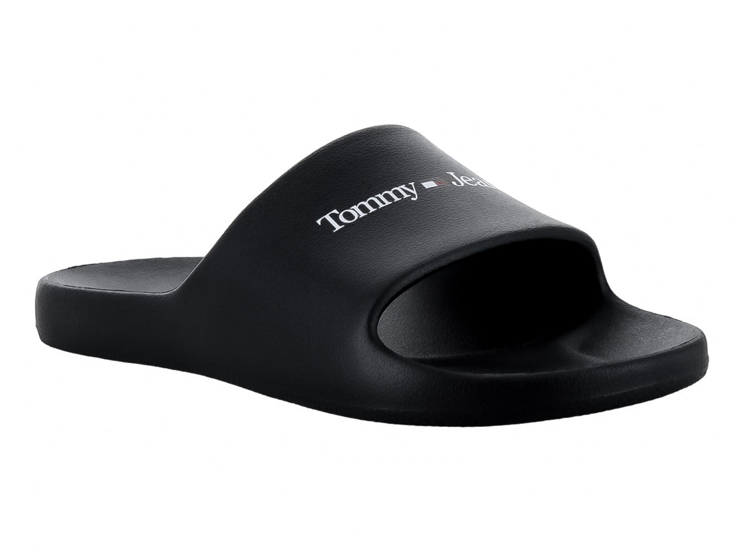 Sandalia tipo slide de color negro con logotipo de Tommy Jeans en blanco sobre la banda.
