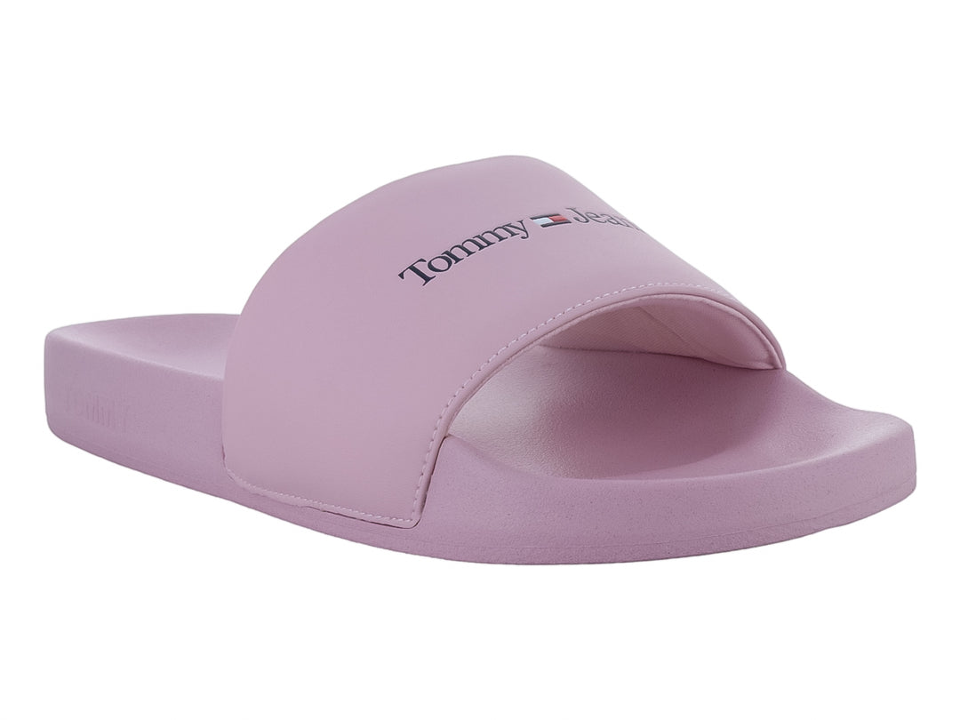 Sandalia tipo slide de color rosa pálido con el logo de Tommy Hilfiger en la correa.