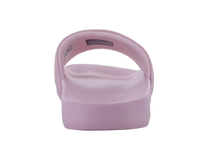 Sandalia tipo slide de color rosa pálido con el logo de Tommy Hilfiger en la correa.