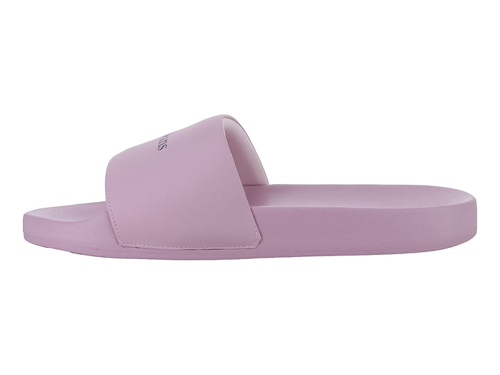 Sandalia tipo slide de color rosa pálido con el logo de Tommy Hilfiger en la correa.