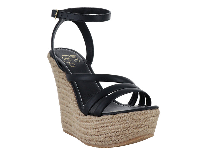 Sandalia de plataforma cuña color negro con base de yute trenzado y correa al tobillo.