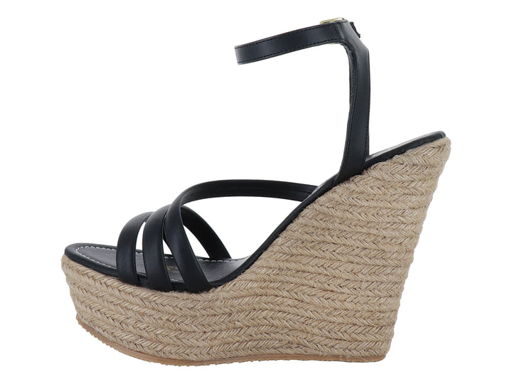 Sandalia de plataforma cuña color negro con base de yute trenzado y correa al tobillo.