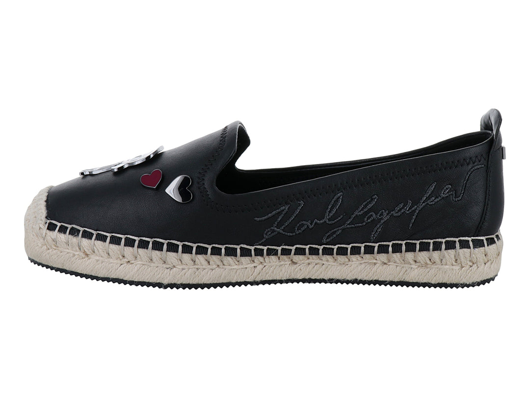 Zapato negro estilo espadrilles con suela de yute y aplicaciones decorativas