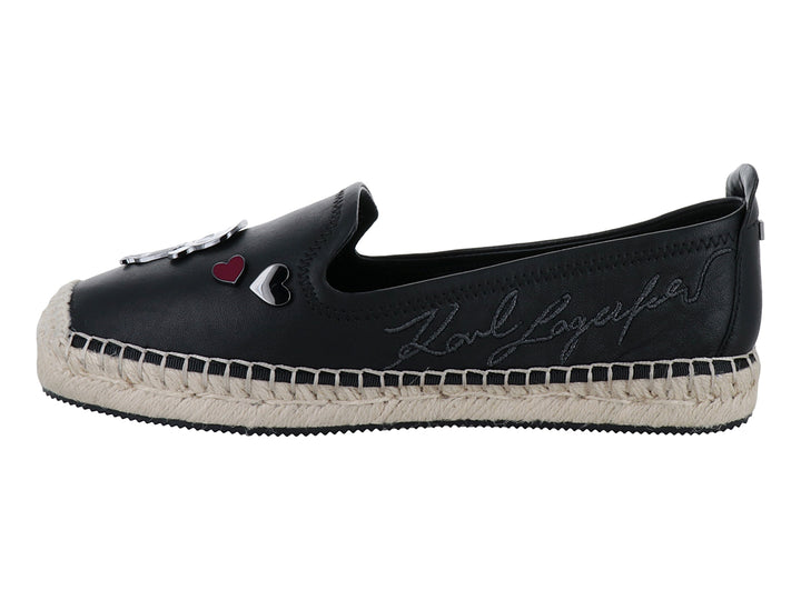 Zapato negro estilo espadrilles con suela de yute y aplicaciones decorativas