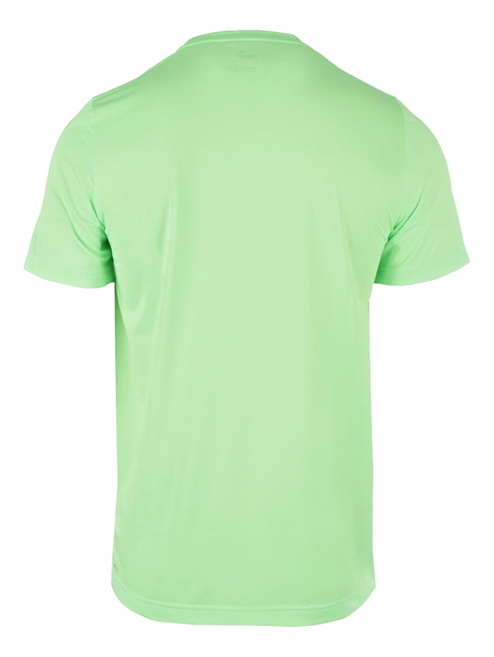 Camiseta deportiva PUMA de color verde lima con logotipo negro en el pecho.