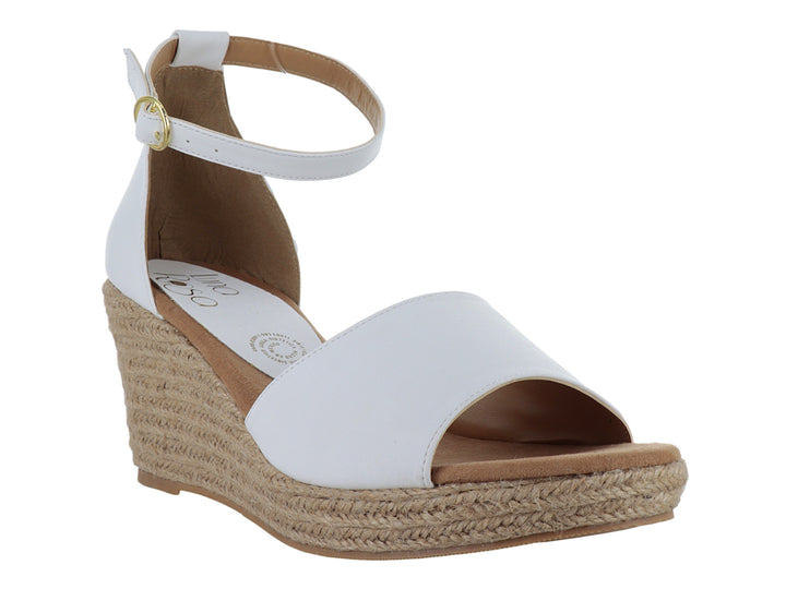 Sandalia blanca para mujer con plataforma de esparto beige y correa ajustable al tobillo.