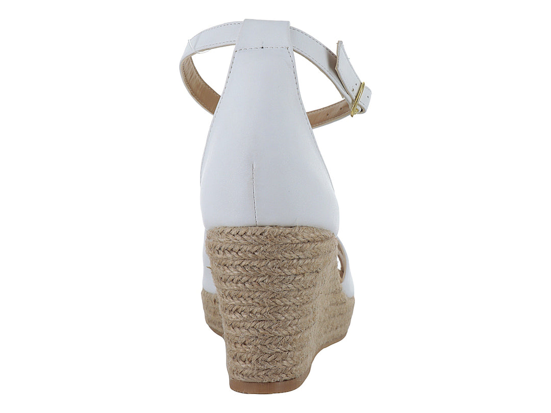 Sandalia blanca para mujer con plataforma de esparto beige y correa ajustable al tobillo.
