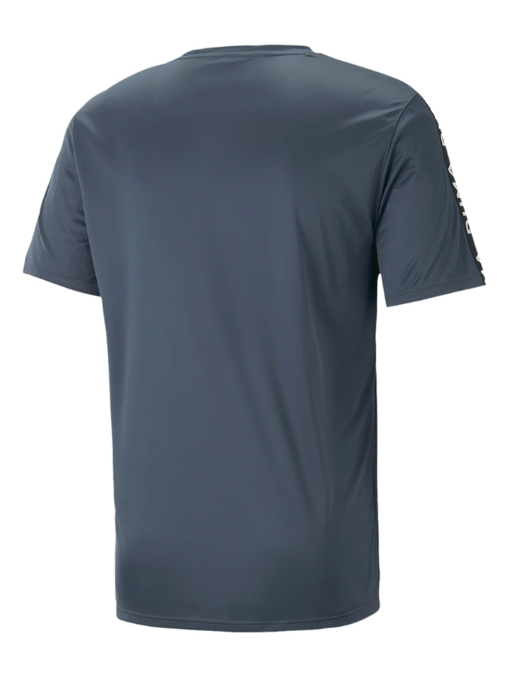 Camiseta deportiva PUMA Slim Fit color azul oscuro con logo blanco y cintas decorativas en los hombros.