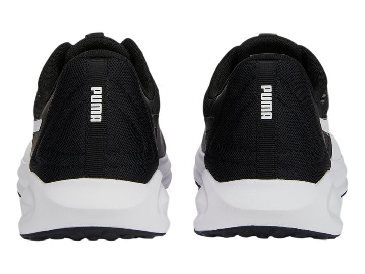 Tenis deportivos PUMA Twitch Runner Fresh en color negro con suela blanca y agujetas negras.