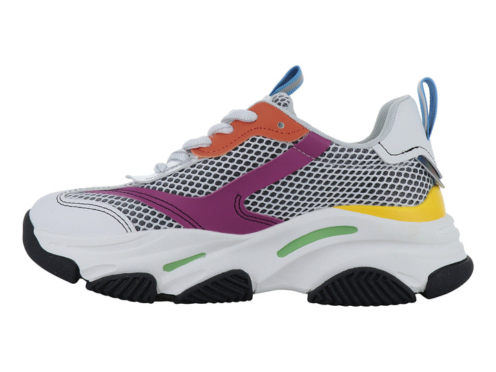Tenis deportivos infantiles blancos con detalles multicolores y suela robusta negra.