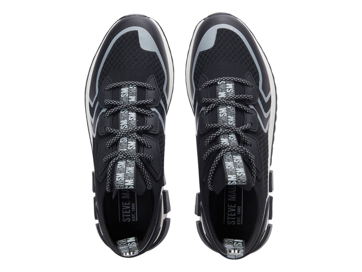 Tenis deportivos Steve Madden Decon en color negro con detalles en gris y suela blanca y negra.
