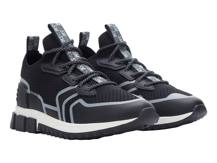 Tenis deportivos Steve Madden Decon en color negro con detalles en gris y suela blanca y negra.