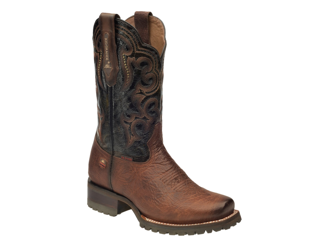 Bota vaquera de cuero color marrón con tubo negro y detalles bordados.