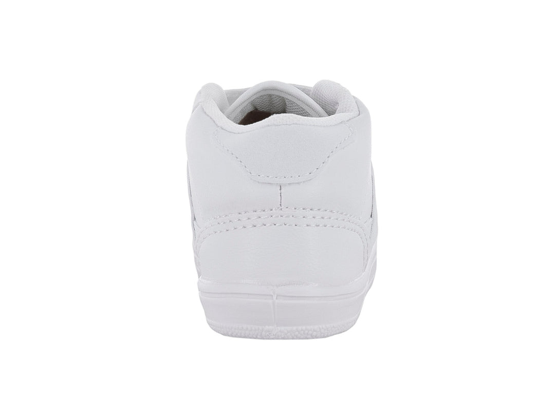 Tenis escolares blancos con cierre de velcro.