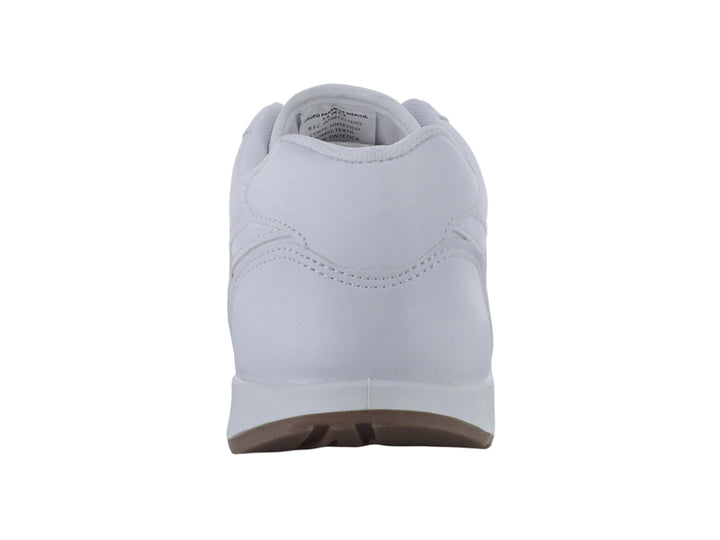 Tenis escolares blancos de la marca Panam con suela color café.