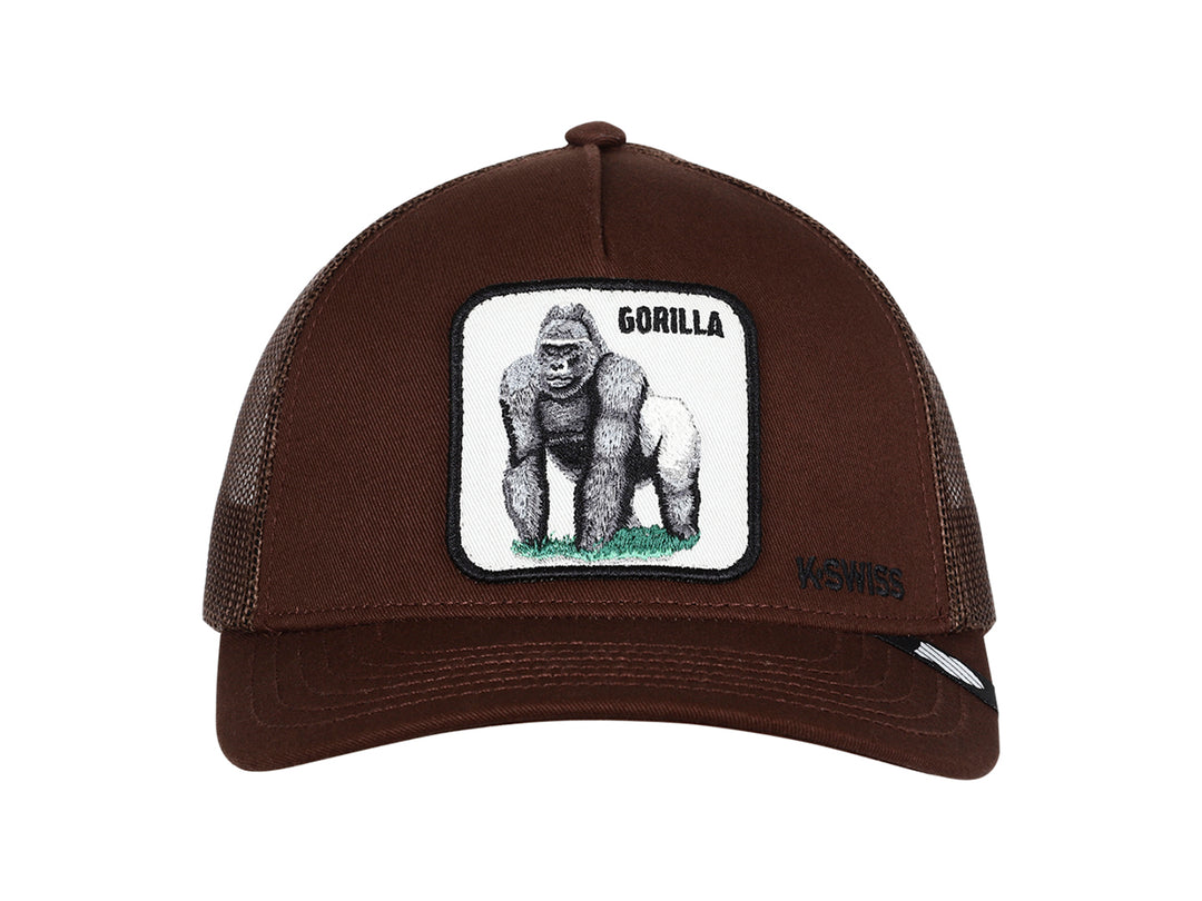 Gorra K-Swiss color café con visera curva, malla trasera y un parche frontal con la imagen de un gorila.