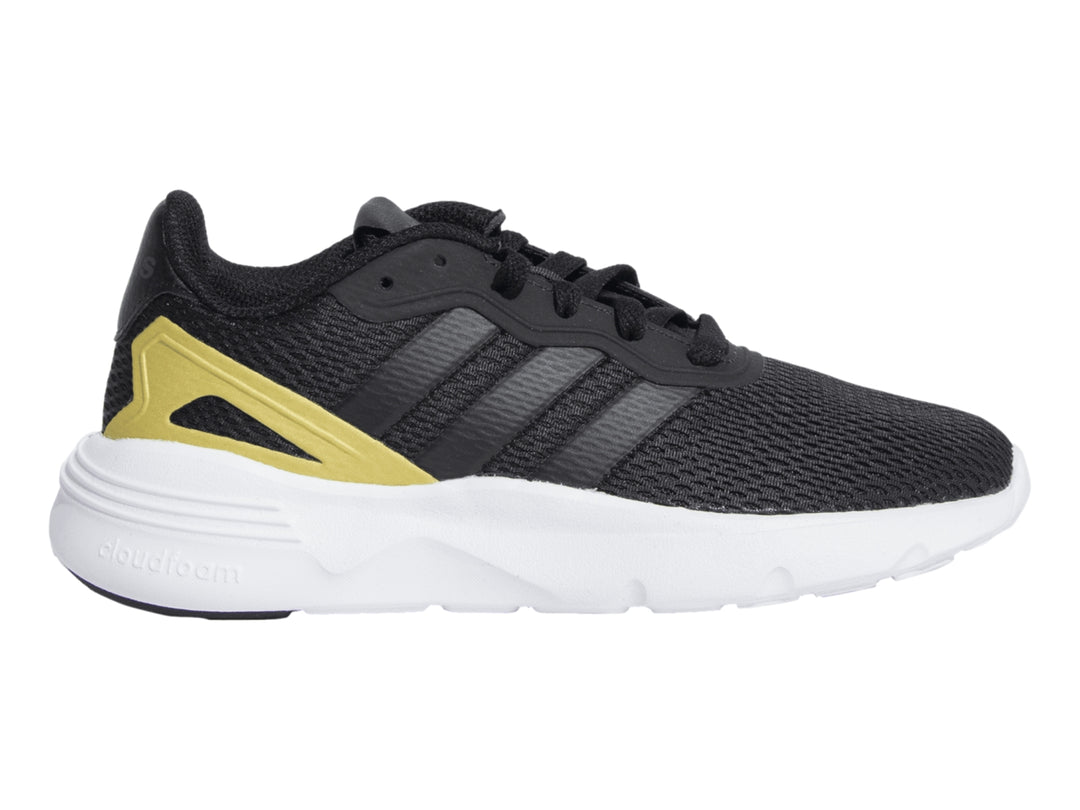 Tenis deportivos Adidas color negro con detalles dorados y suela blanca.