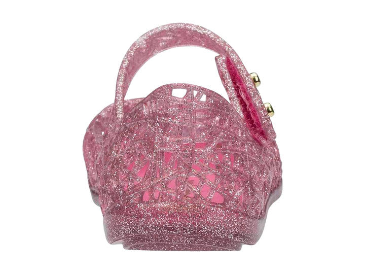 Sandalia rosa brillante para niña de la marca Mini Melissa con diseño calado y correa ajustable.